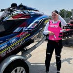 Professional jet ski rider Kanina ready for a race next to her Yamaha Waverunner on a trailer