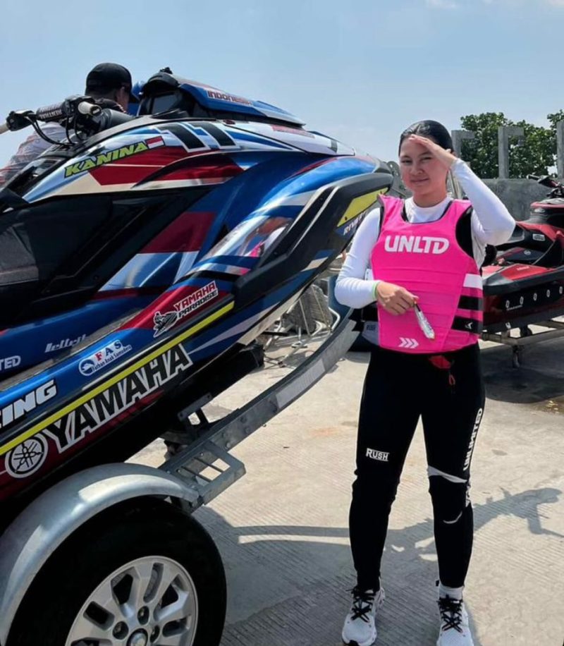 Professional jet ski rider Kanina ready for a race next to her Yamaha Waverunner on a trailer